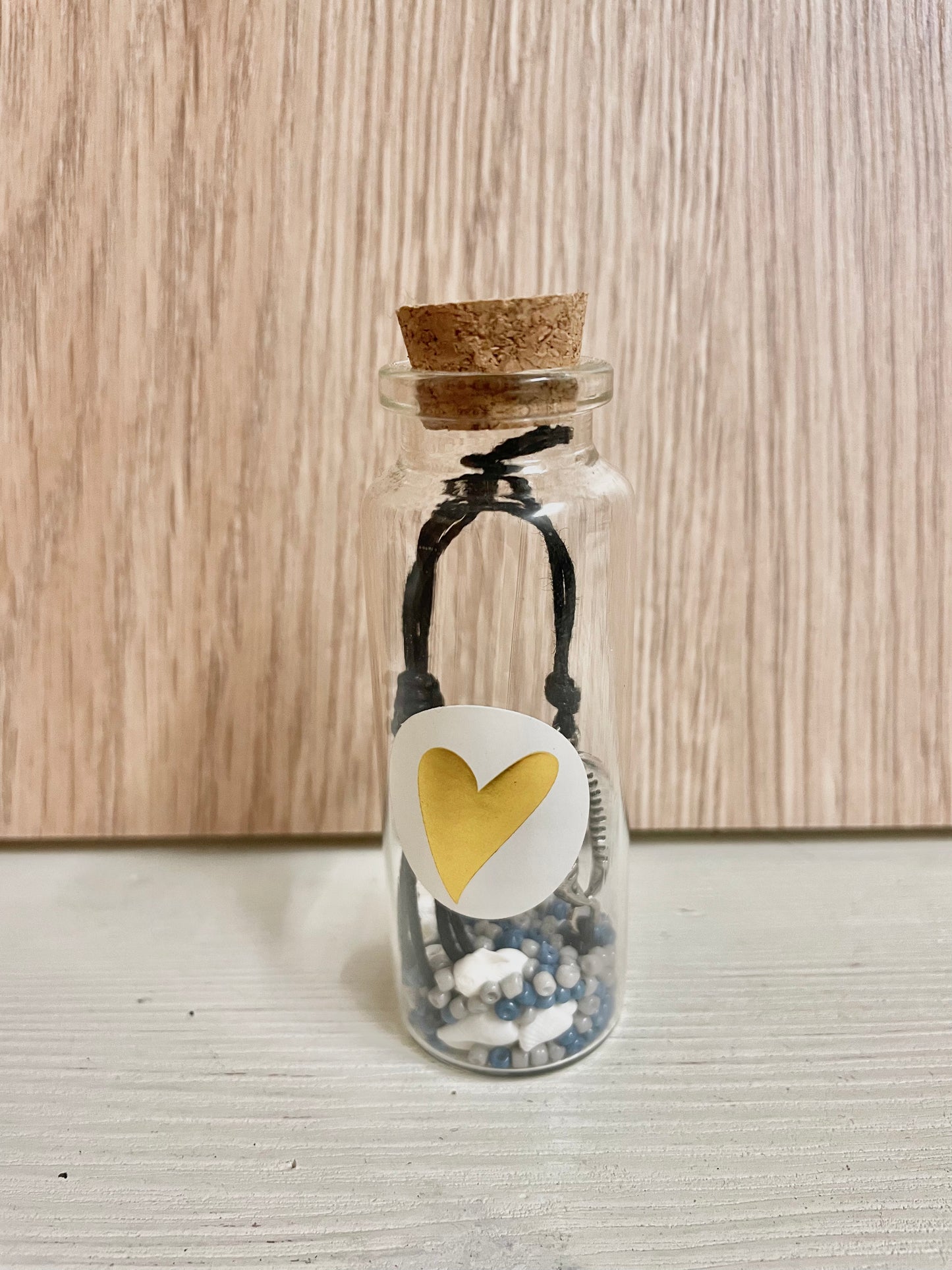 Cadeaupotje met verstelbare touwarmband schelp